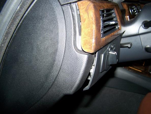 Remove left decorative strip on instrument panel