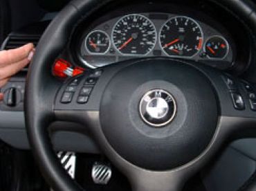 Depress steering wheel retainers