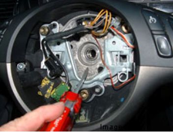 Unbolt steering wheel