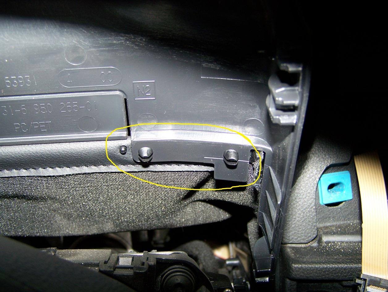 Remove upper section of steering column trim